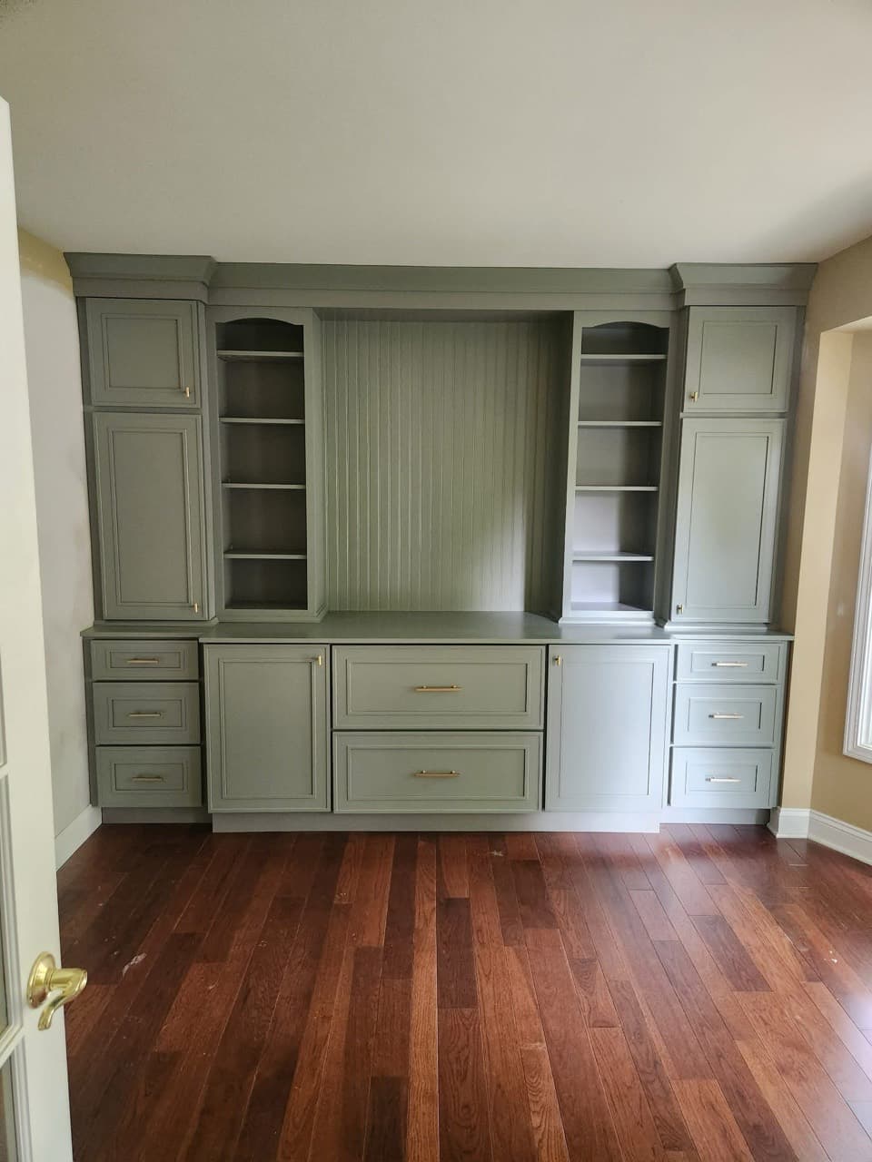 Custom sage built-in cabinetry by DHR